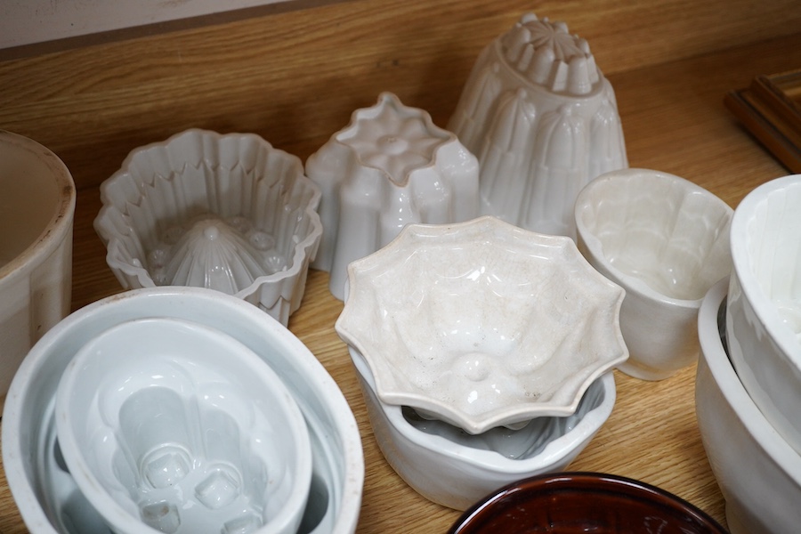 Twenty early 20th century ceramic jelly moulds, including an example by Shelley, etc. Condition - fair